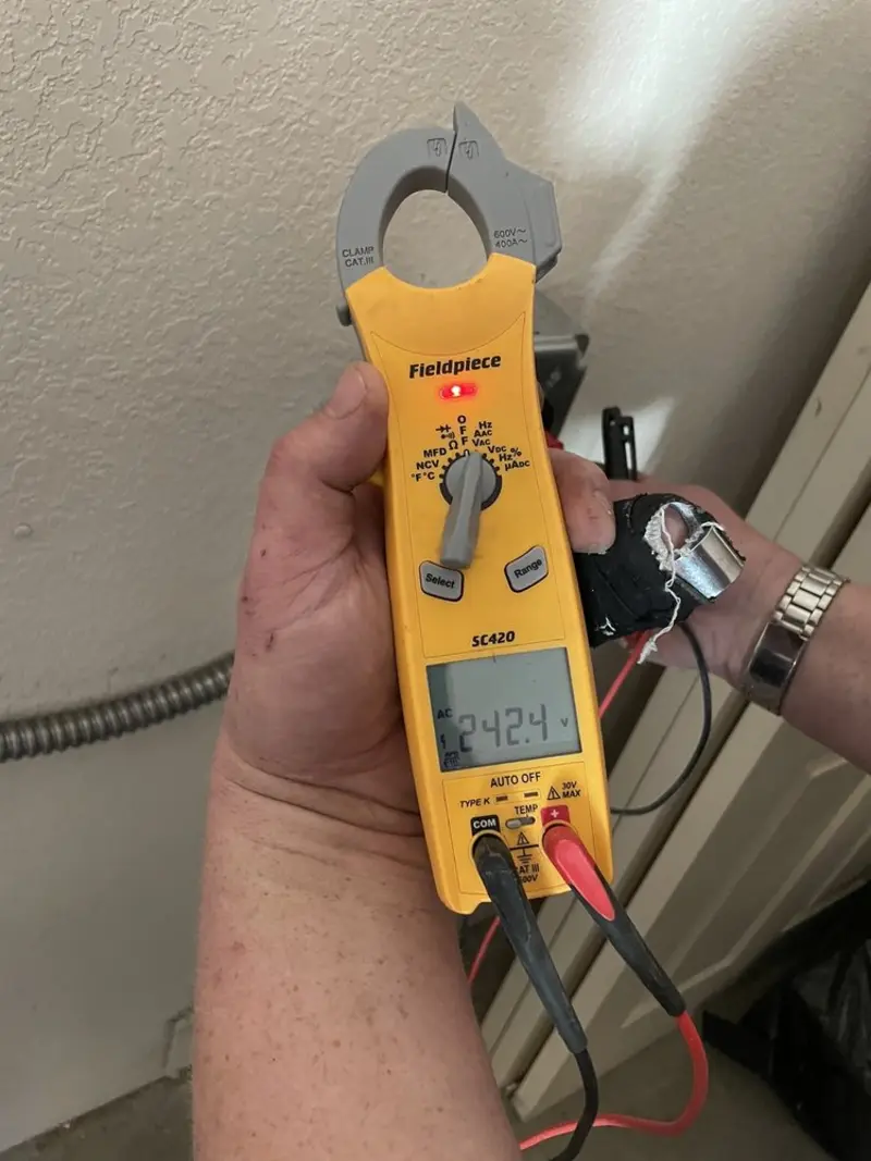 Voltage testing with clamp meter during Electrical Installation Services in Los Alamitos